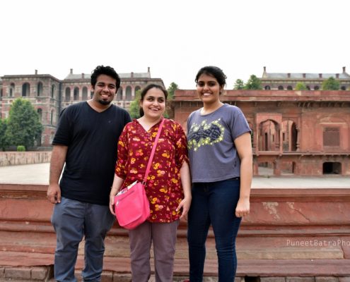 Three people posing in a golden triangle tour